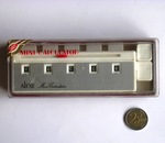 The Alexe Mini Calculator, in box