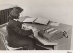 Photo of woman at desk with Comptometer 992