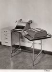 Photo of table with typewriter and Comptometer 992
