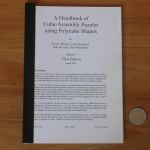 A Handbook of Cube-Assembly Puzzles using Polycube Shapes